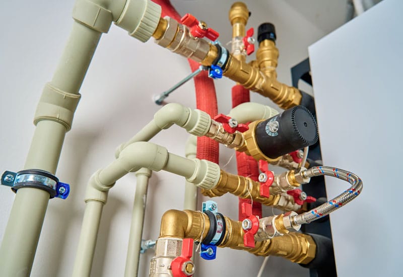 Plastic supply piping connected to metal valves